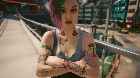 Best Cyberpunk 2077 mods - Judy is standing with her arms crossed and an angry expression.