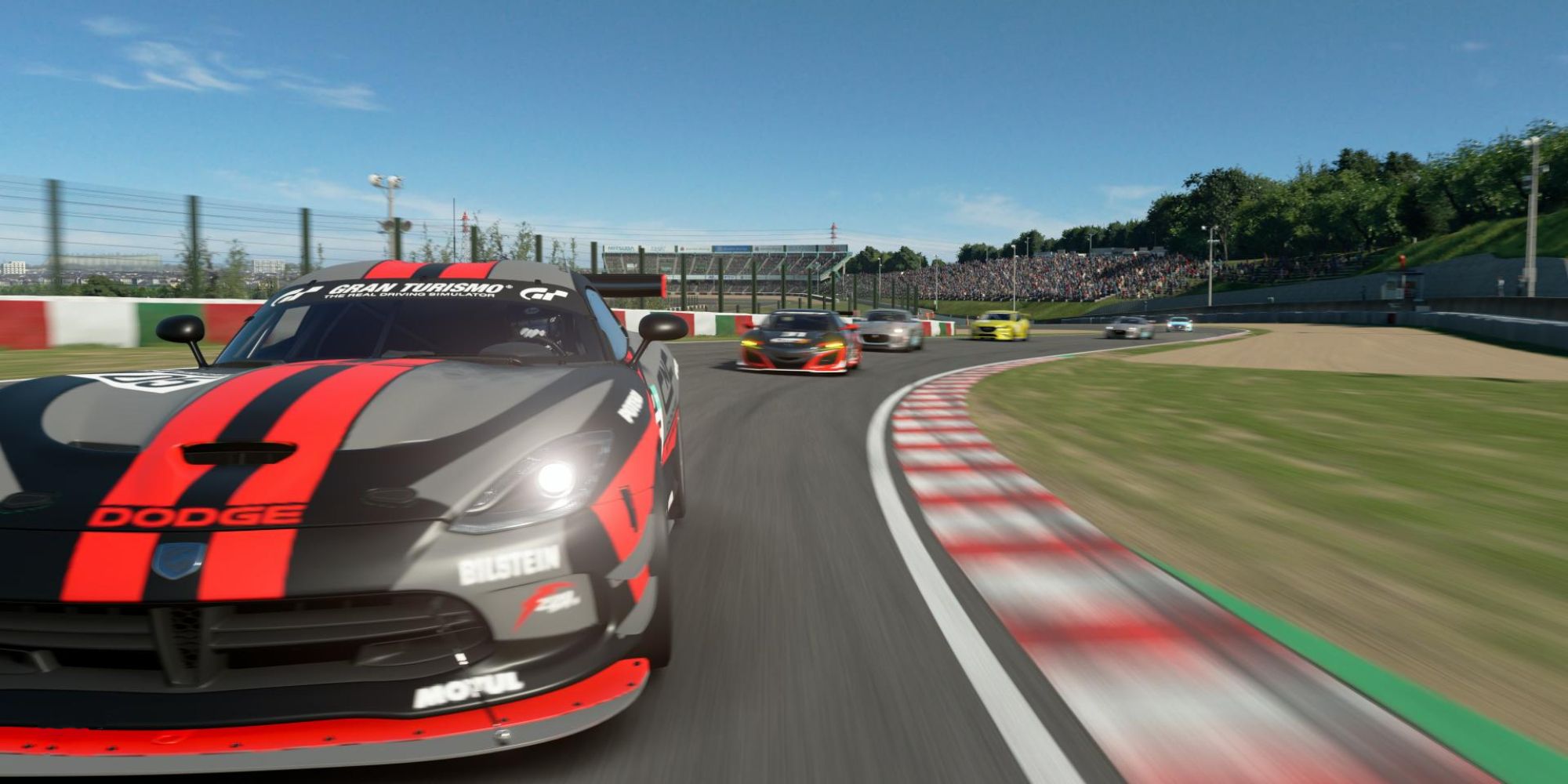 A screenshot of cars racing around the Suzuka Circuit in Gran Turismo Sport.