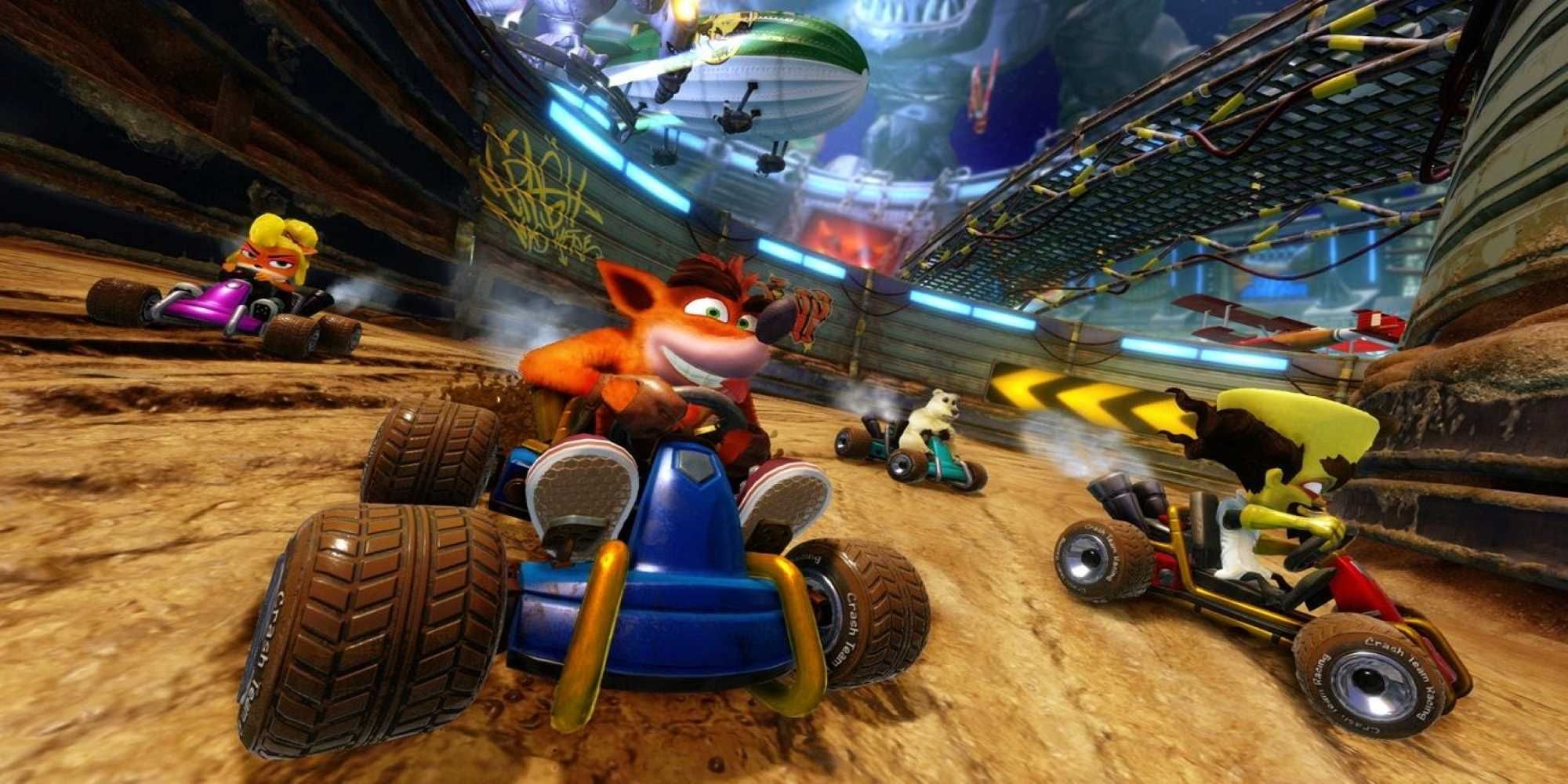 Crash, Coco, Dr. Neo Cortex, and Polar race through a dirt-racing arena in Crash Team Racing: Nitro Fueled.