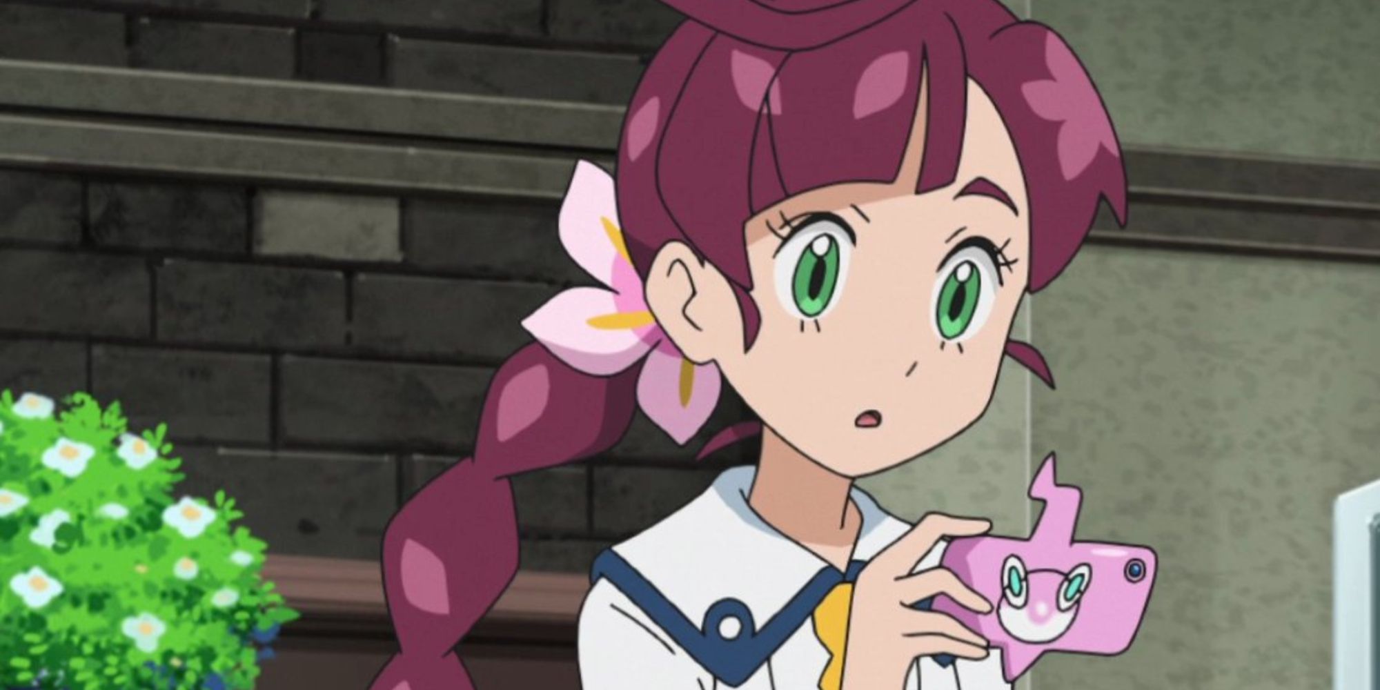 chloe from pokemon journeys looking at her pink rotom phone