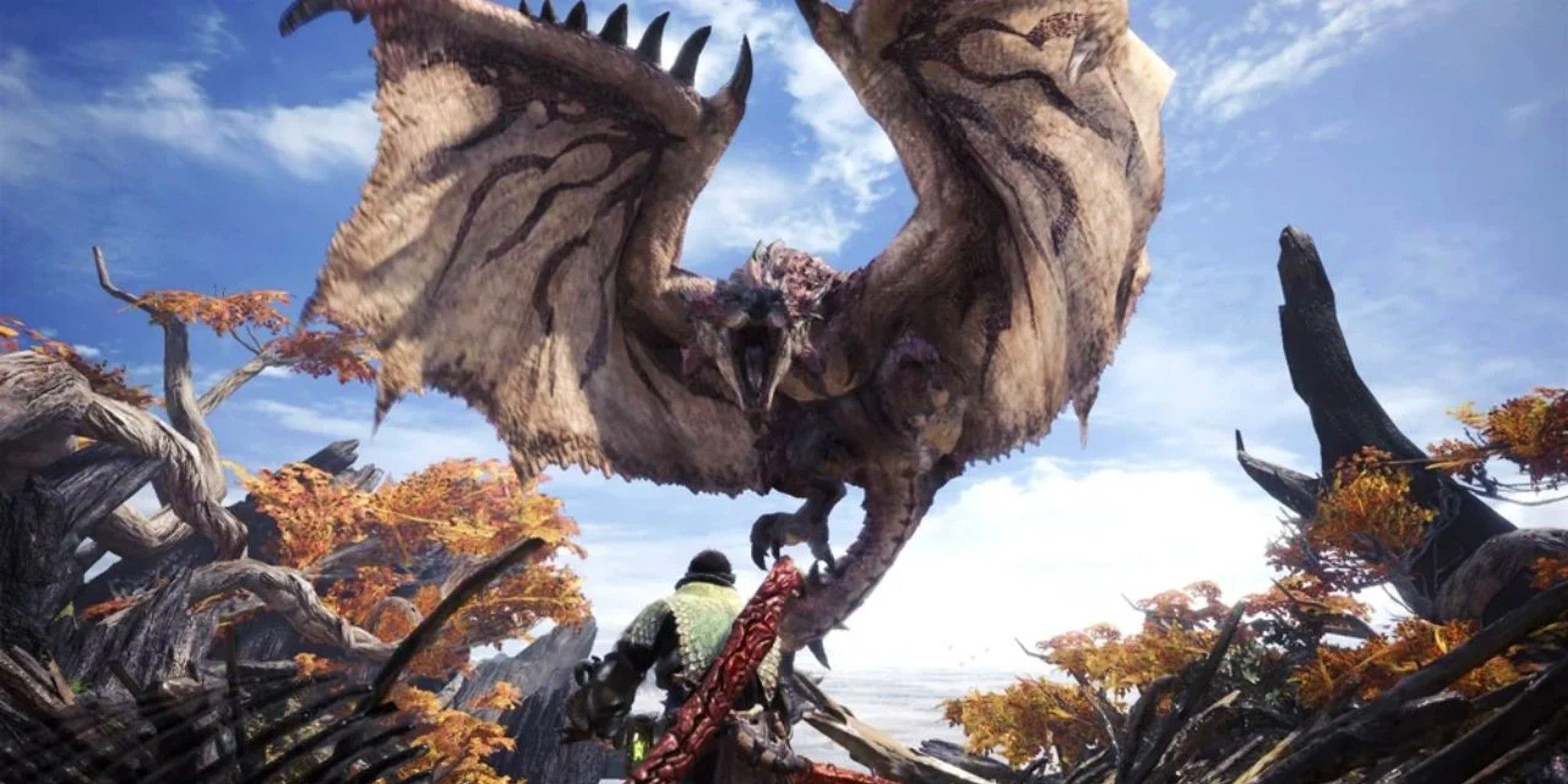 Rathalos spreads his wings and roars in Monster Hunter World.