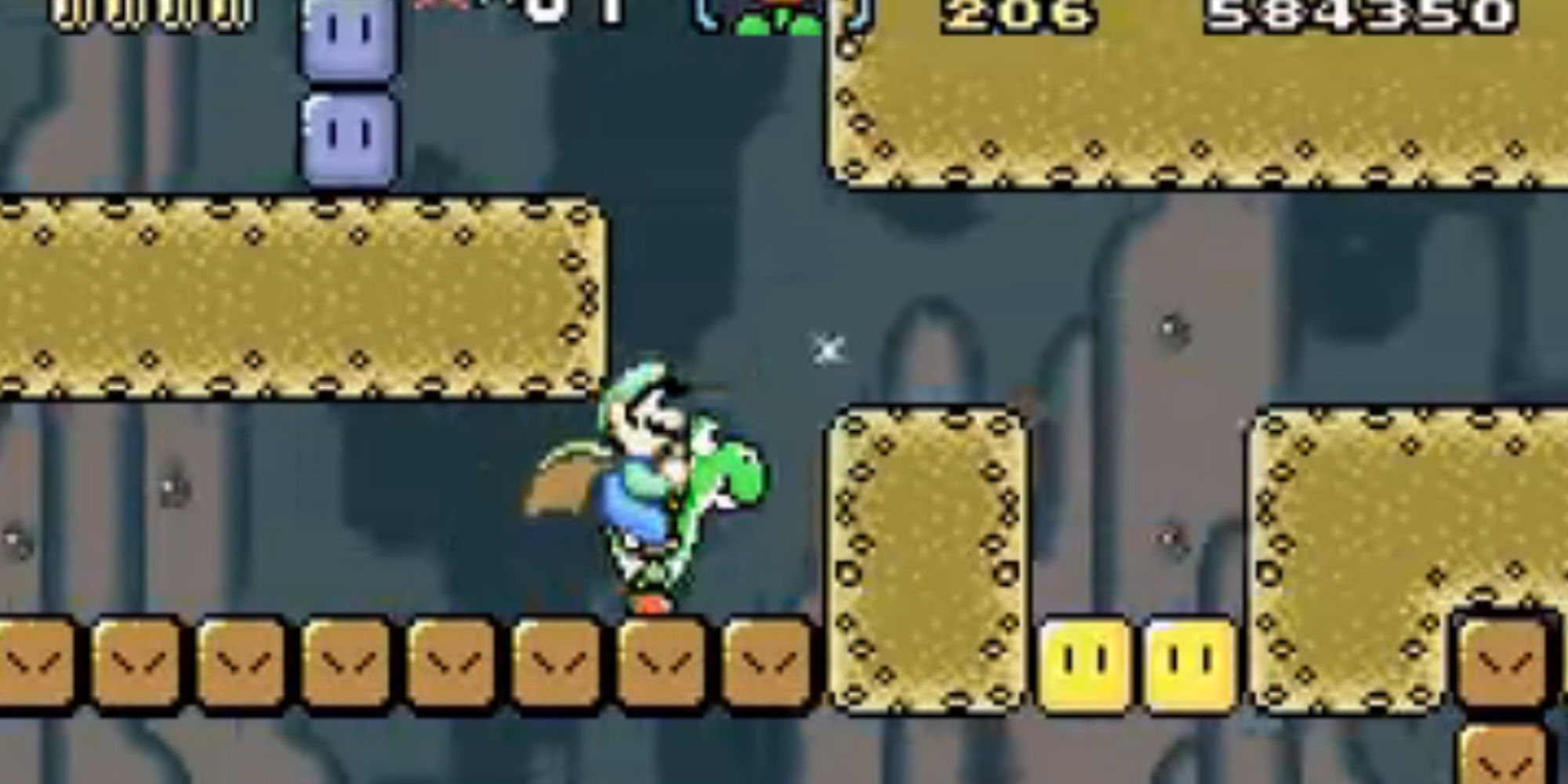 Luigi rides Yoshi through an underground tunnel.