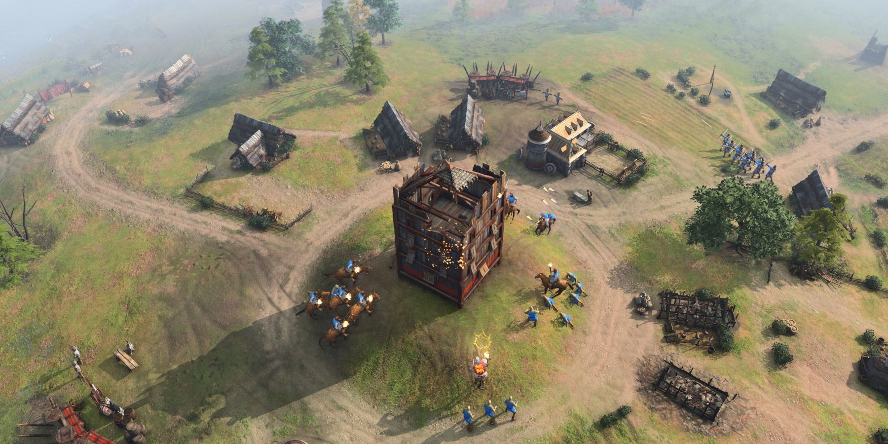 Units stand around a central fortification on a small hill in Age of Empires 4