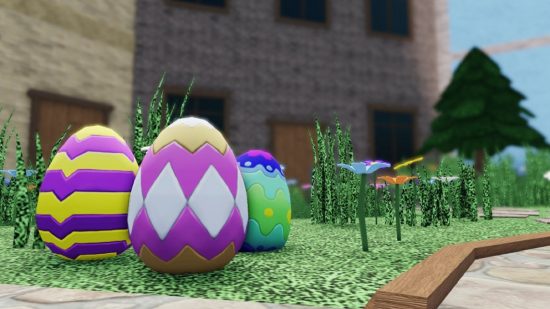 Some easter eggs sitting on a patch of grass.