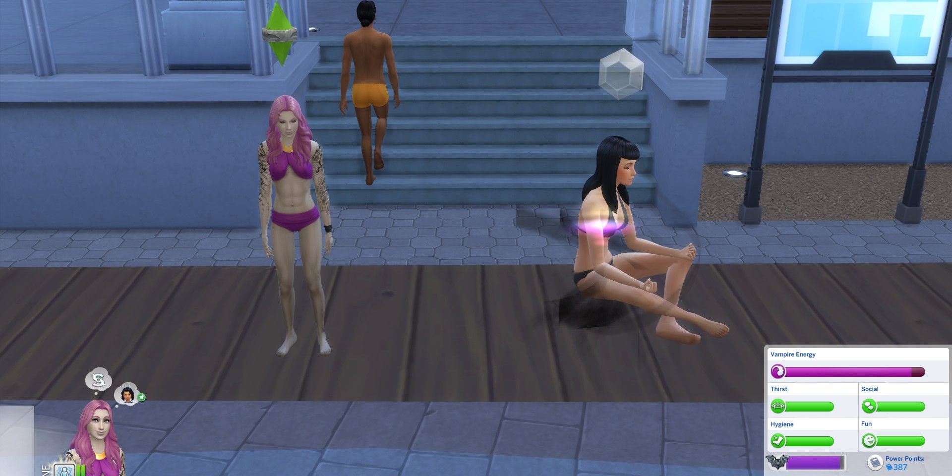 A vampire Sim in a bikini stands next to another Sim meditating.