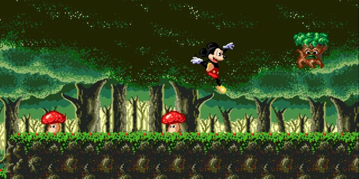 Castle of Illusion - Mickey jumping through an enemy-filled forest.