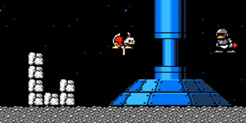 DuckTales game on NES: Scrooge pogo-hops through the moon level.