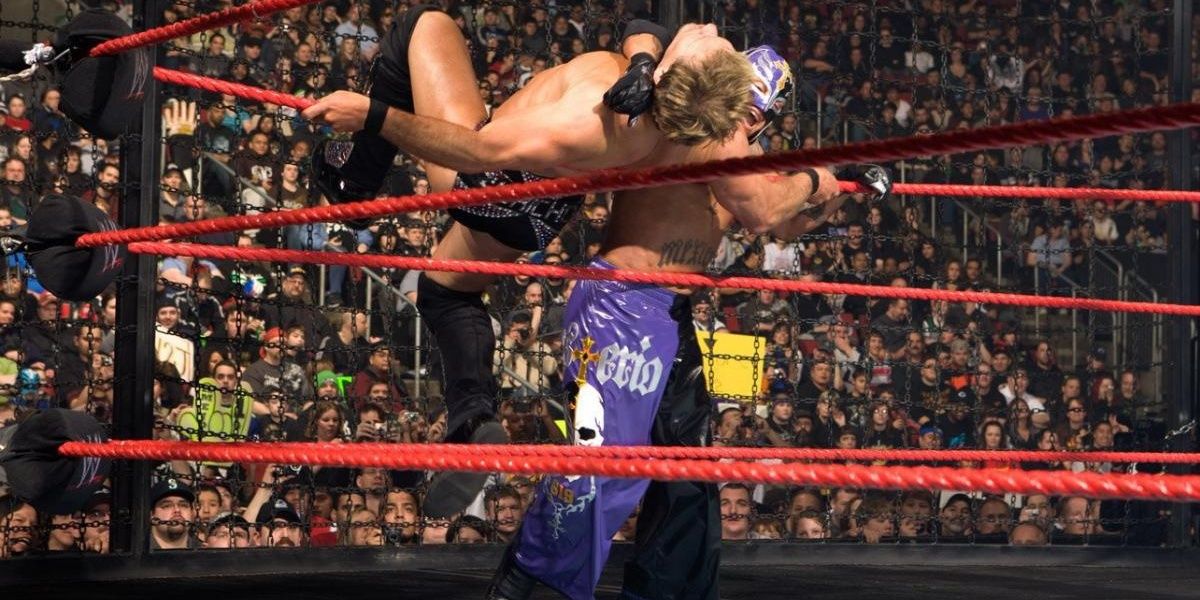 Rey Mysterio Clotheslining Chris Jericho over the ropes