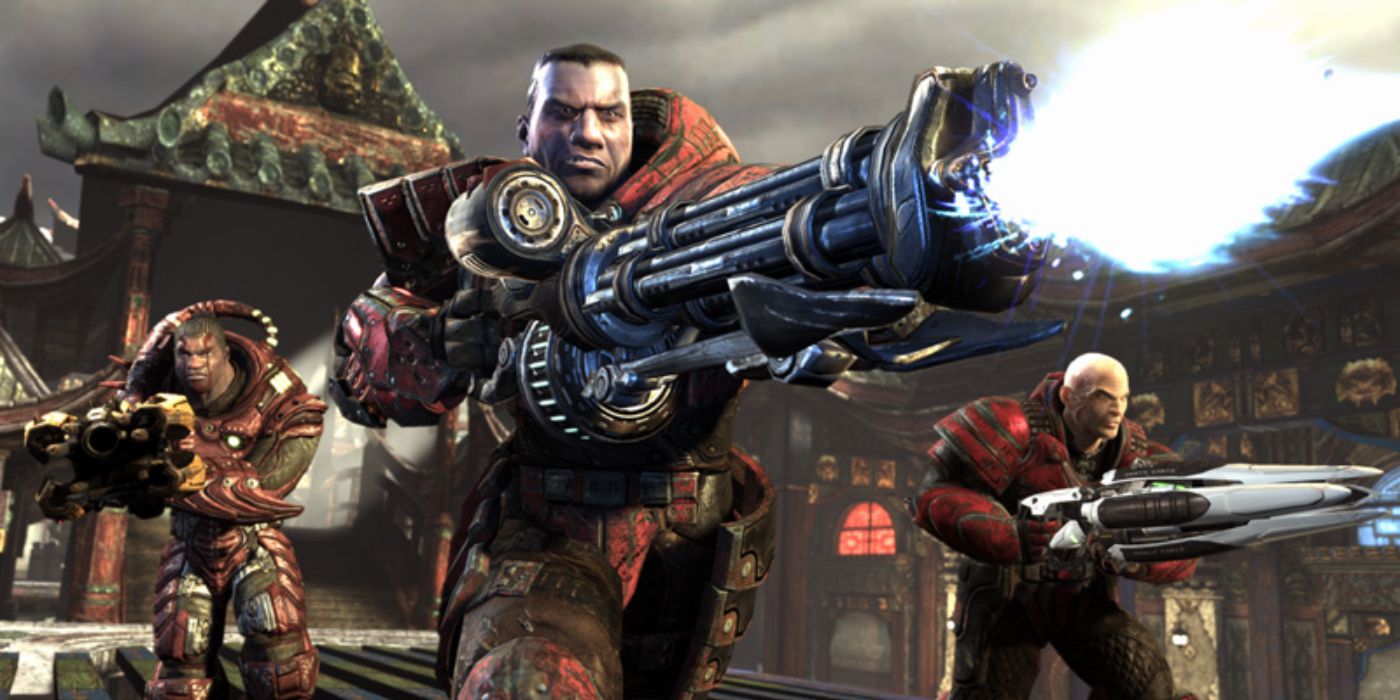 Unreal Tournament 3 promotional image of three red soldiers with large weapons.