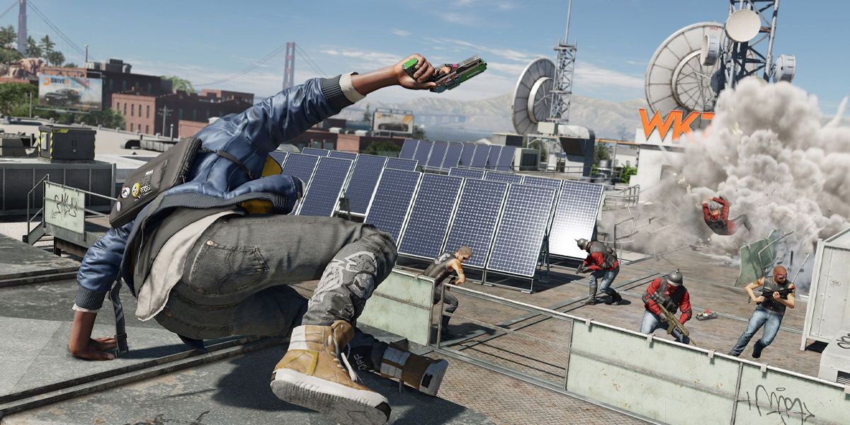 Watch dogs 2 screenshot of Marcus leaping over a wall as an explosion goes off a little in front of him.