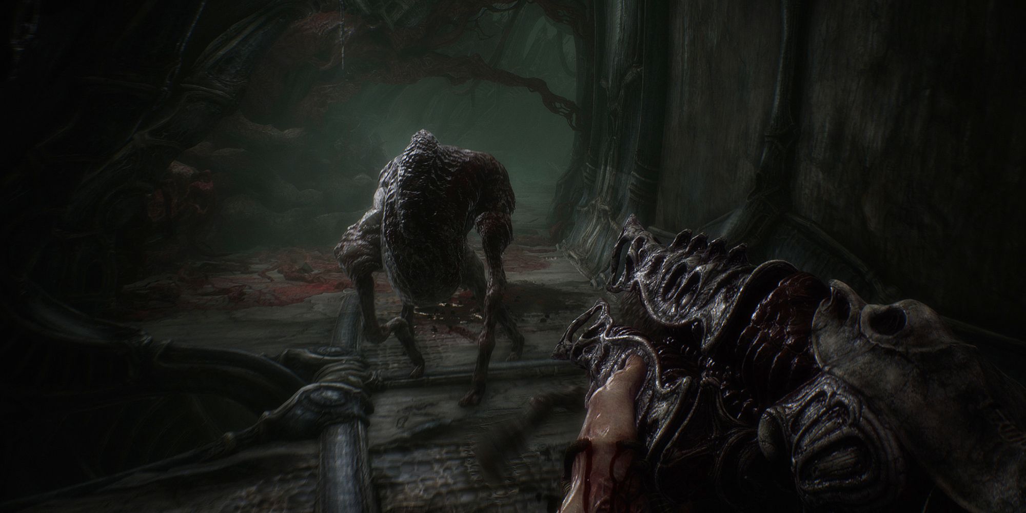 A humanoid protagonist pointing a weird alien gun at creature in Scorn.