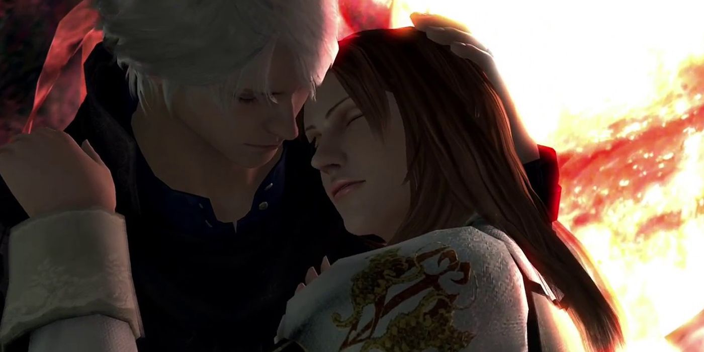 Devil May Cry screenshot of Nero holding Kyrie in his arms and putting his face closer to hers in a show of affection, flames seen in the background.