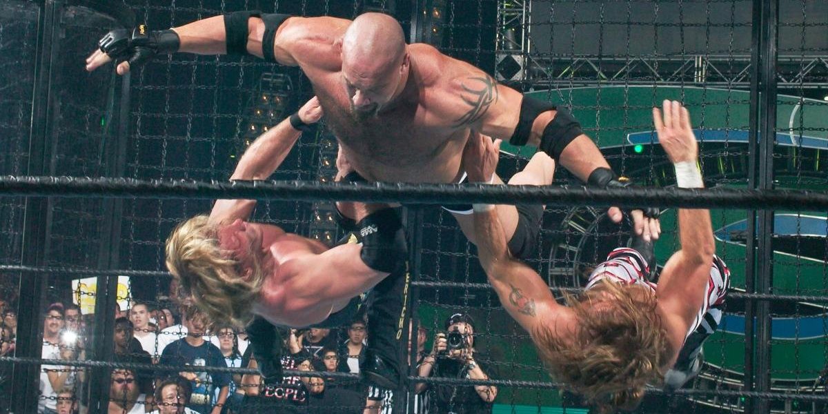 Goldberg tackling Chris Jericho & Shawn Michaels