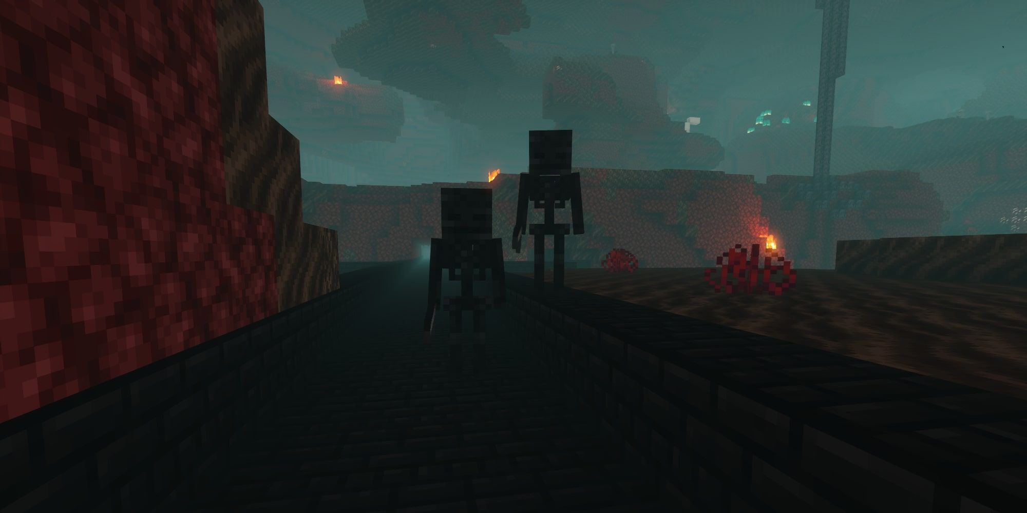 A player in darkness looking at two Wither Skeletons in a Nether Fortress. 