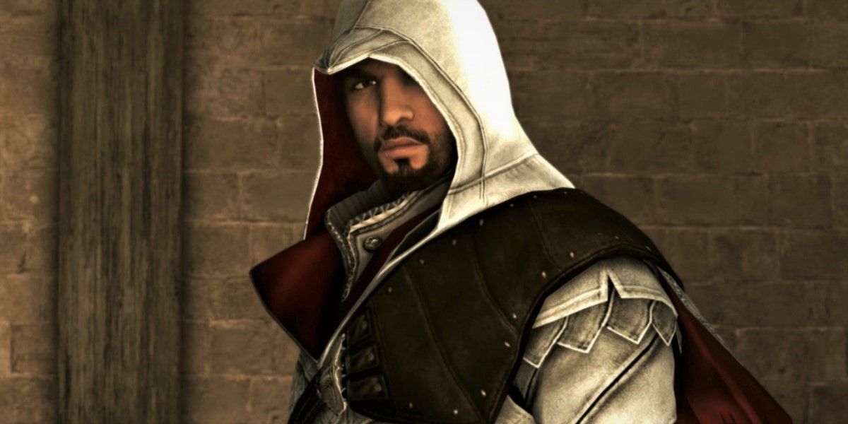 Assassin's Creed Brotherhood Screenshot Of Ezio Auditore with his hood up, looking into the camera.