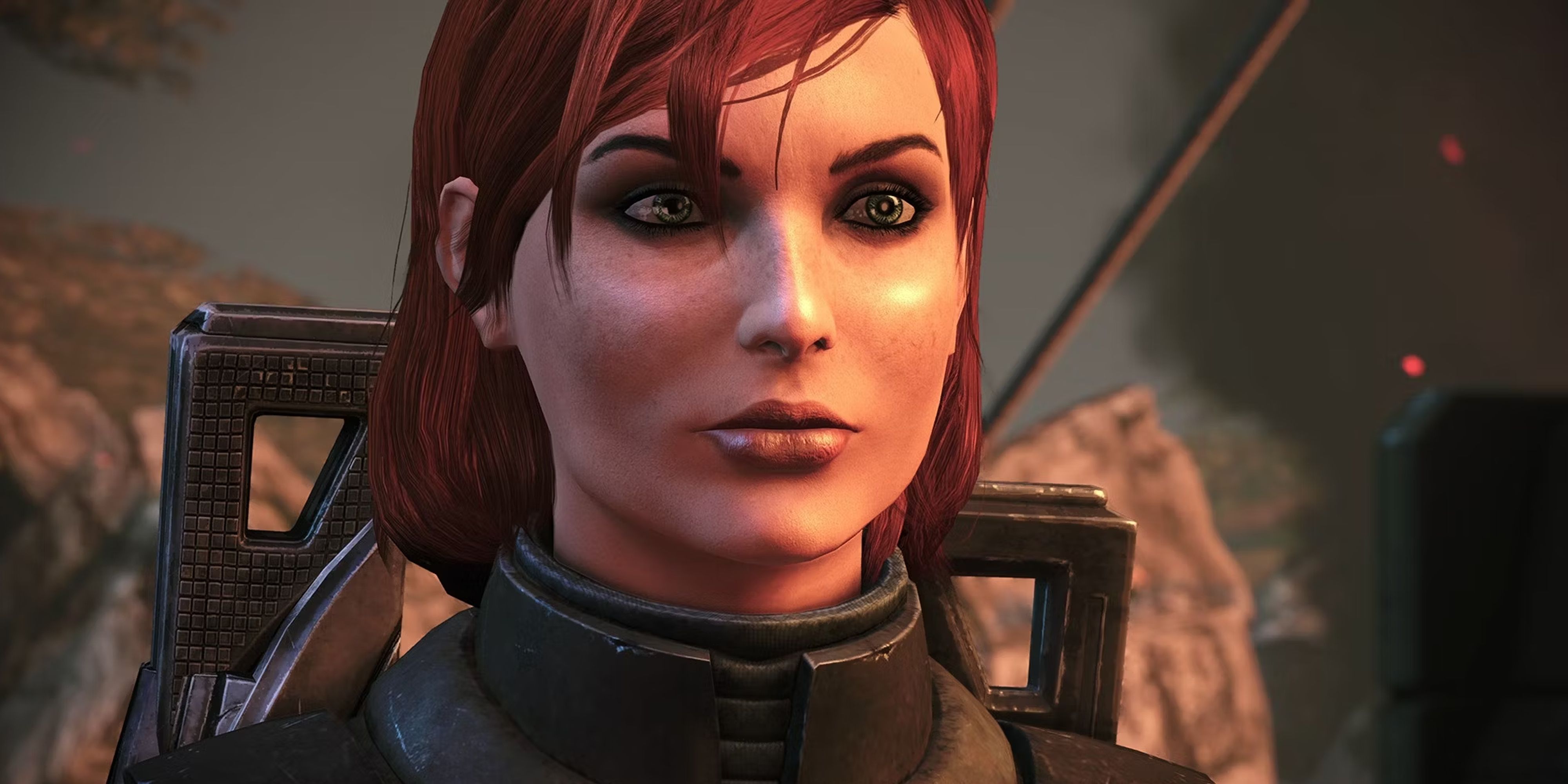 Mass Effect Female Shepard in combat armour standing in front of rocks and smoke.