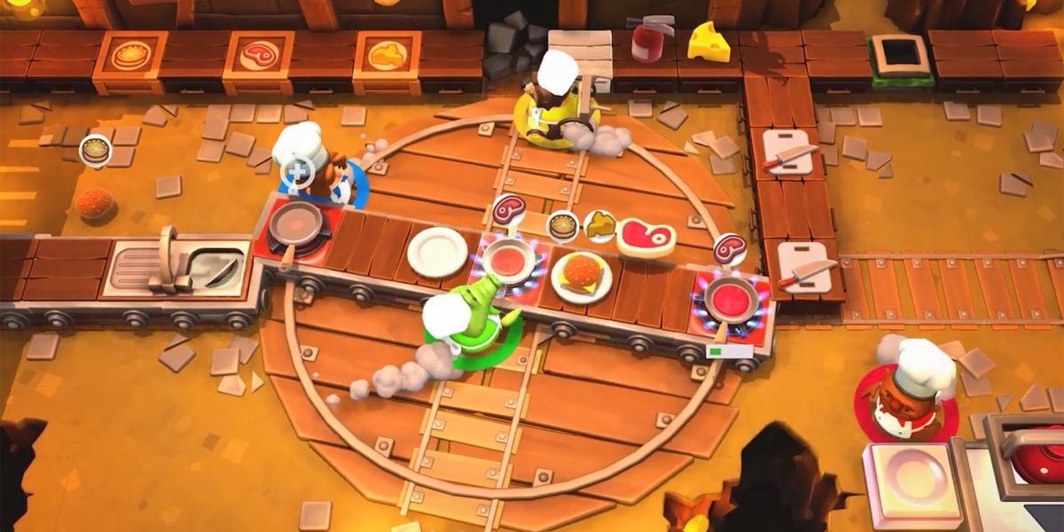 Overcooked 2 screenshot of four players preparing food and running in Rail Track Stage.