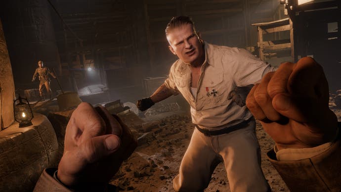 The player raises their fists to fight a large blonde brute in Indiana Jones and the Great Circle