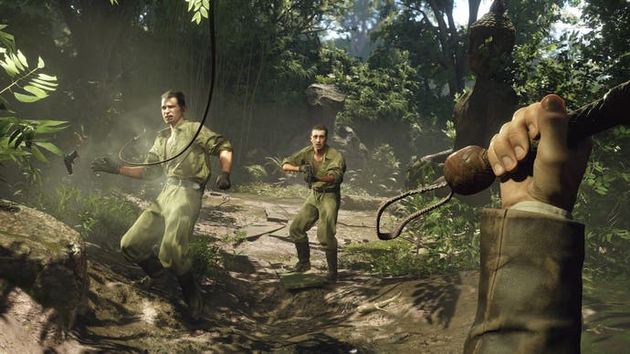 The player uses Indy's whip to crack a gun out of a soldier's hand in the jungle in Indiana Jones and the Great Circle