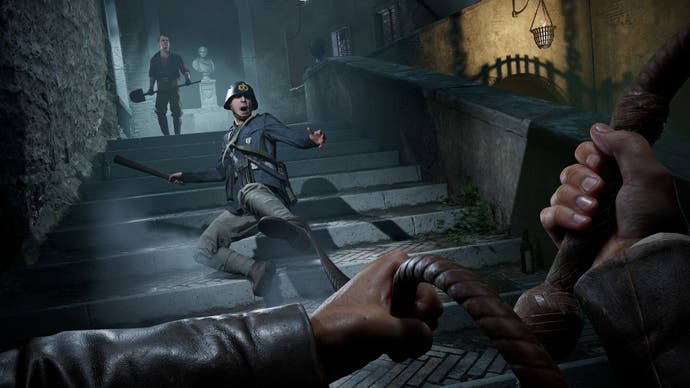 The player uses Indy's whip to trip up a soldier coming down some stairs in the dark in Indiana Jones and the Great Circle