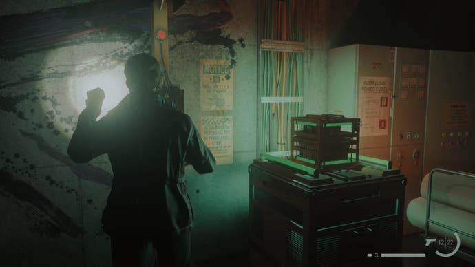 Kiran Estevez places a cube energy core on a machine in Alan Wake 2's The Lake House DLC.