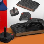 Atari VCS next to controller, joystick, box, and hat