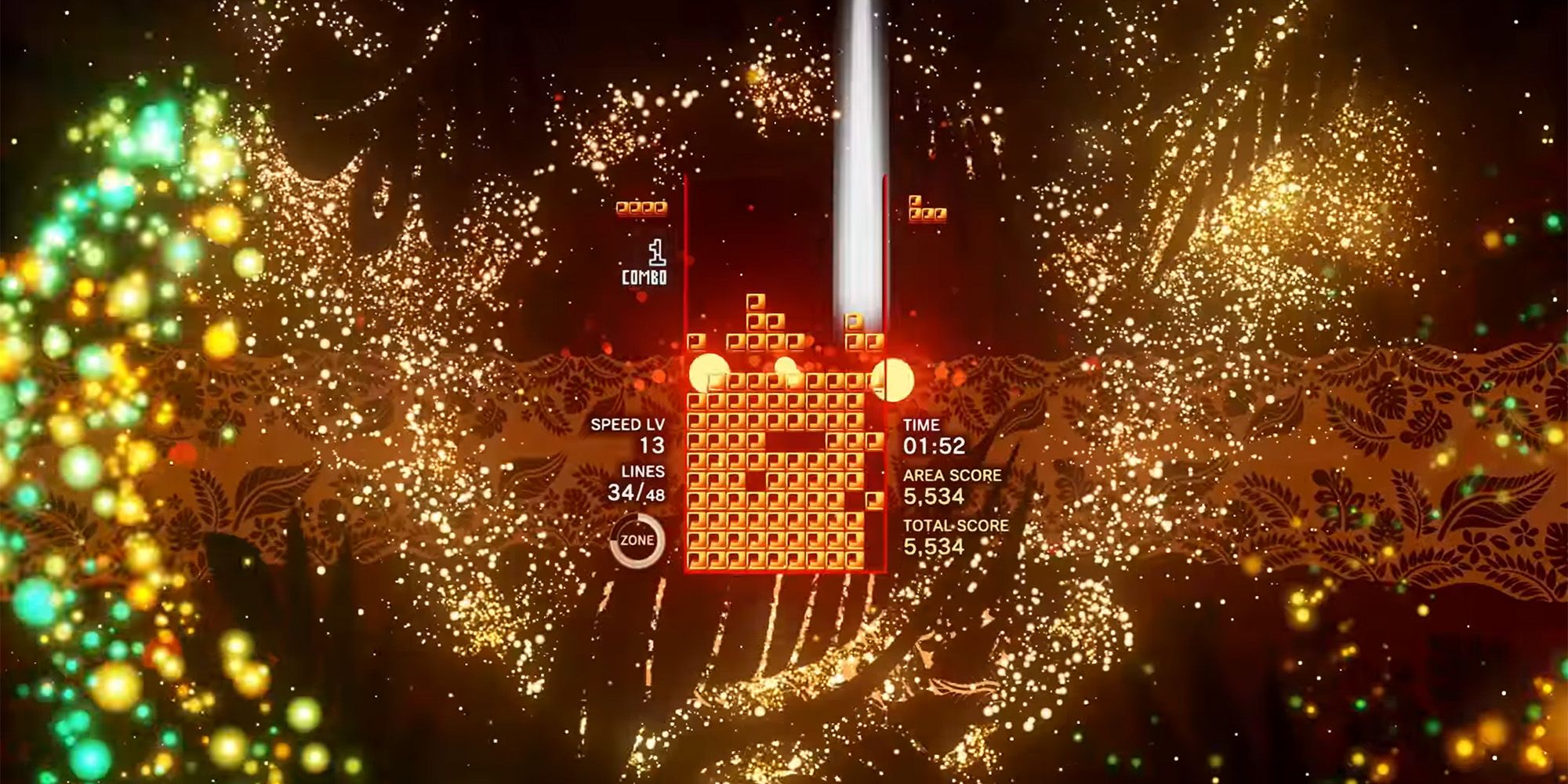 Orange, yellow, and green sparkles surrounding orange tetrominoes in Tetris Effect Connected.