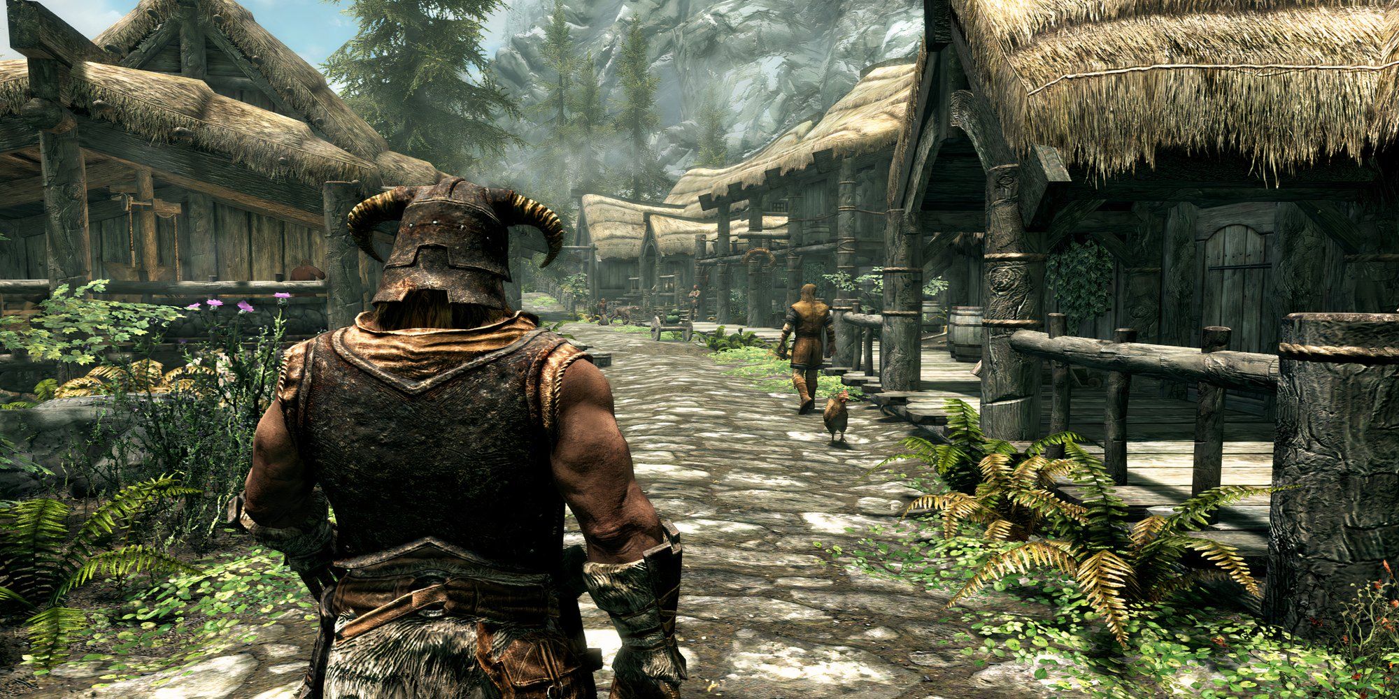 The Dragonborn walks through a peaceful village in The Elder Scrolls 5: Skyrim.