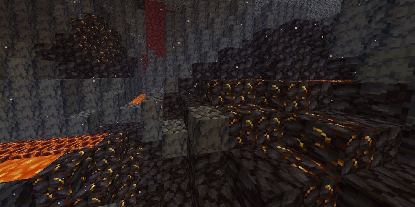 A player looking at a large stretch of gilded blackstone in the Nether. 