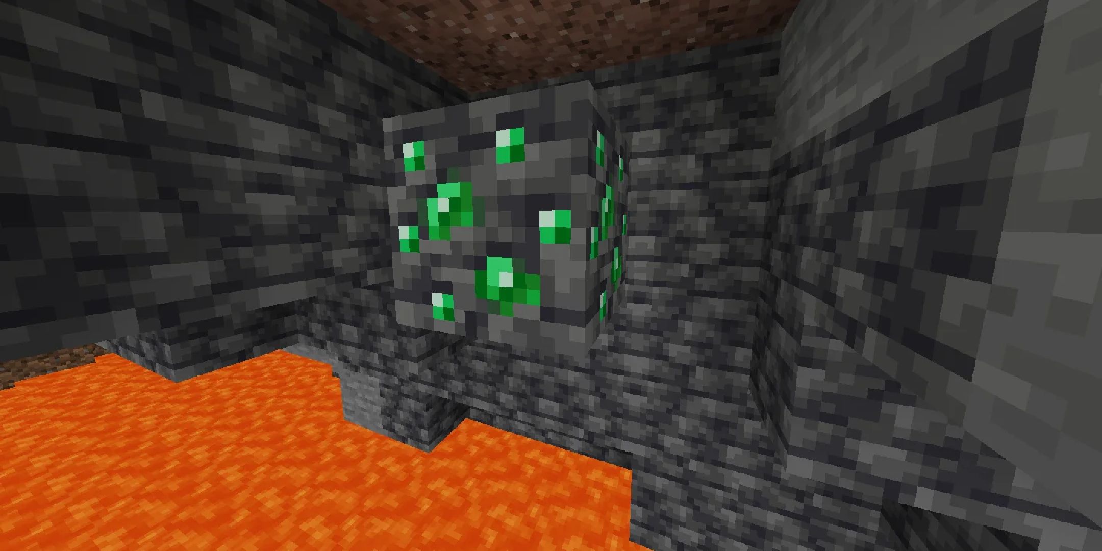 Emerald Deepslate Ore in a cavern above lava.