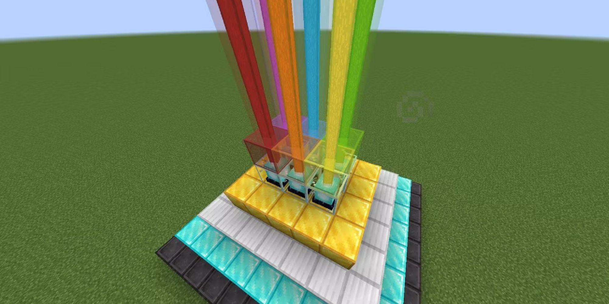 A large beacon in Minecraft with each beam as a different color, which is done with stained glass.