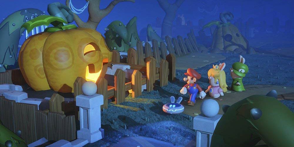 Beep-O, Mario, Rabbid Peach and Rabbid Luigi stroll past a giant pumpkin in Mario + Rabbids Kingdom Battle.