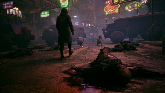 A screenshot from Slitterhead showing a man walking across a zebra crossing, bodies littering the ground. Neon lights glow in the background.