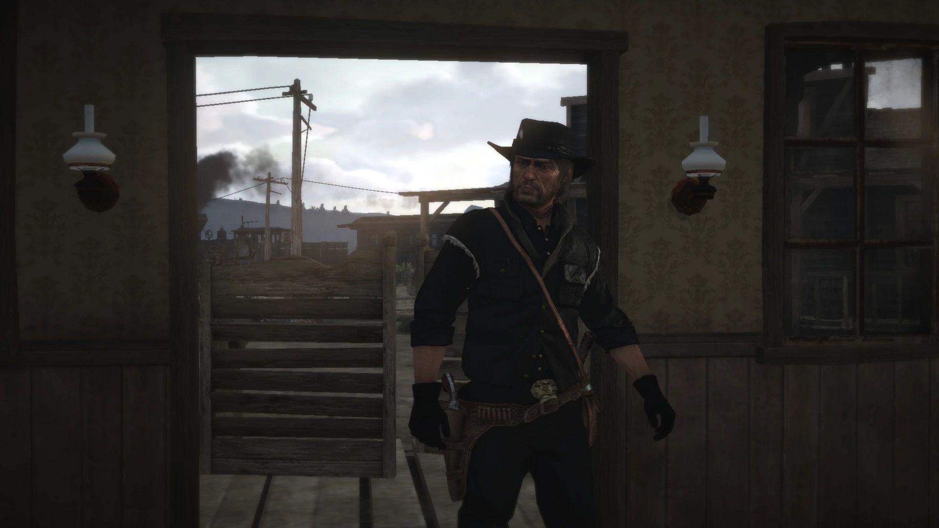 John Marston enters a building wearing dark clothes in Red Dead Redemption.