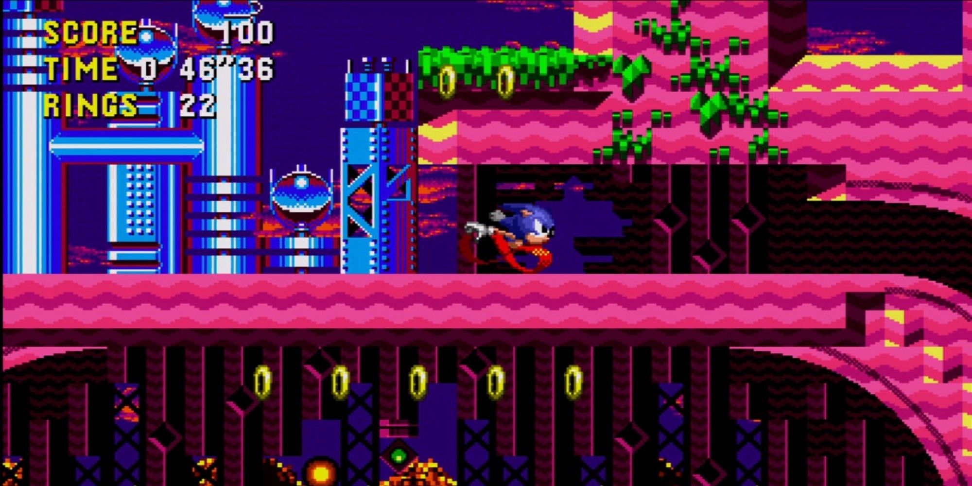 Sonic CD gameplay, with Sonic about to enter a spindash tunnel.