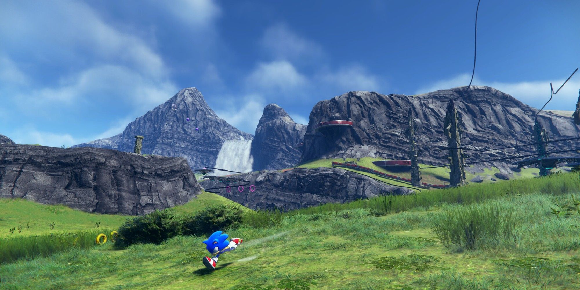 Sonic running across a grassy field in Sonic Frontiers. 