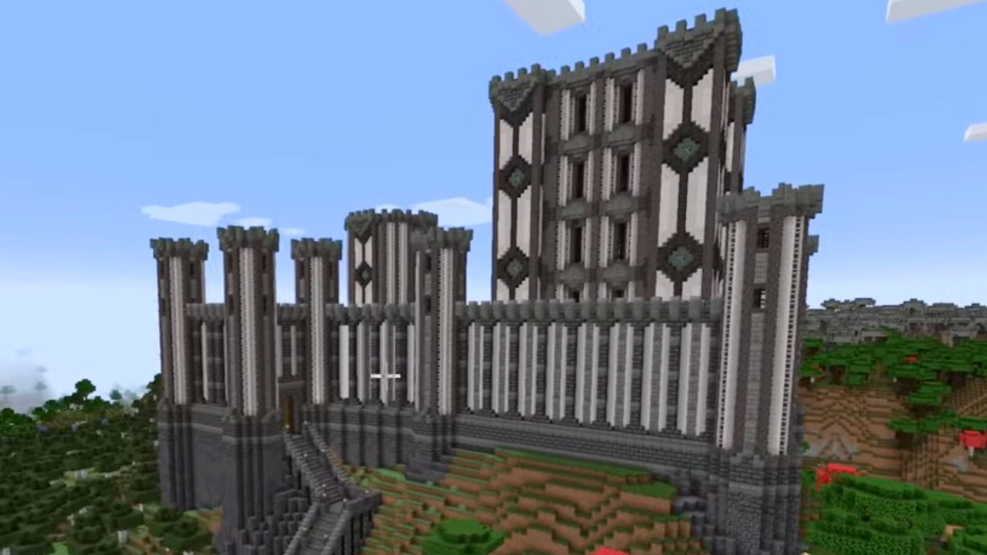 A large, majestic Minecraft castle made of stone and pale oak.