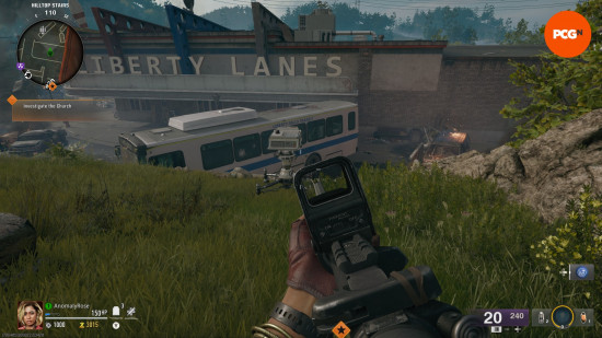 A white projector on the grassy bank beside the bowling alley in the Black Ops 6 Zombies Liberty Falls easter egg main quest.