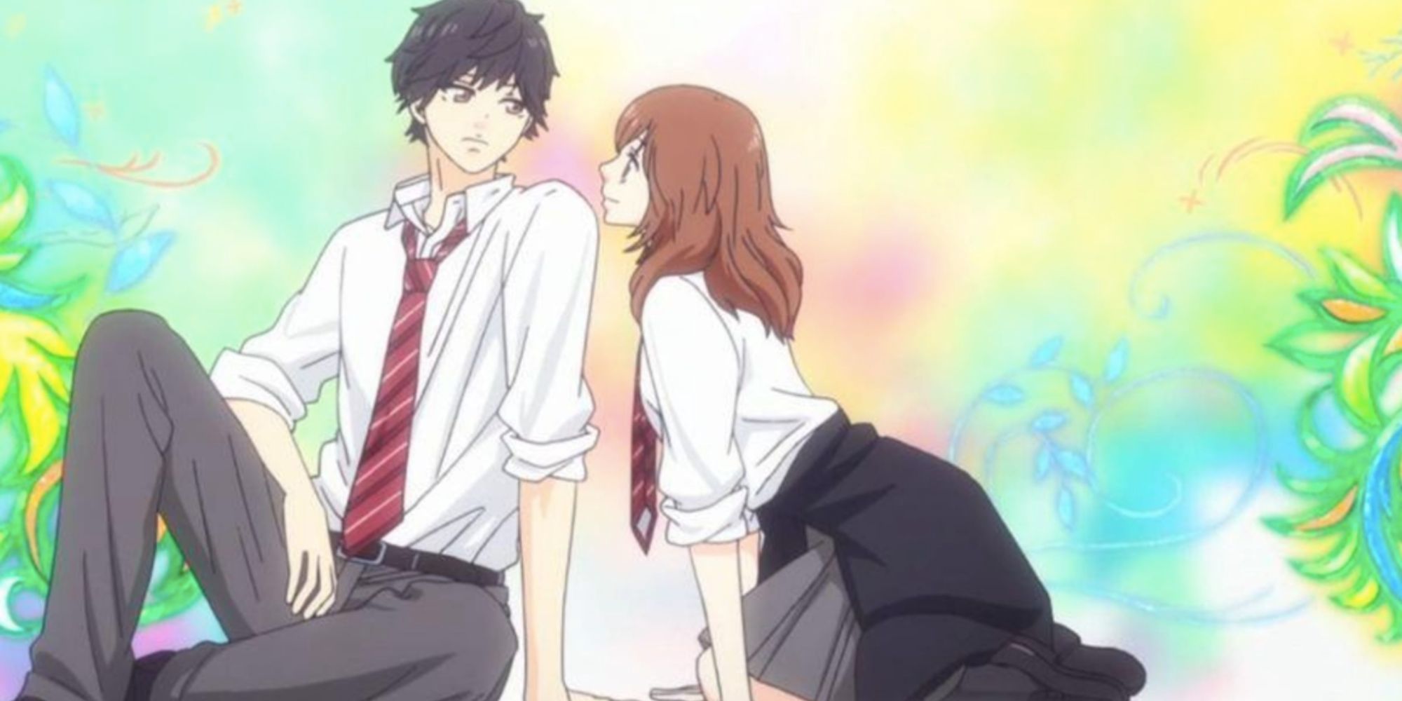 a brunette girl looks longingly towards a black haired boy