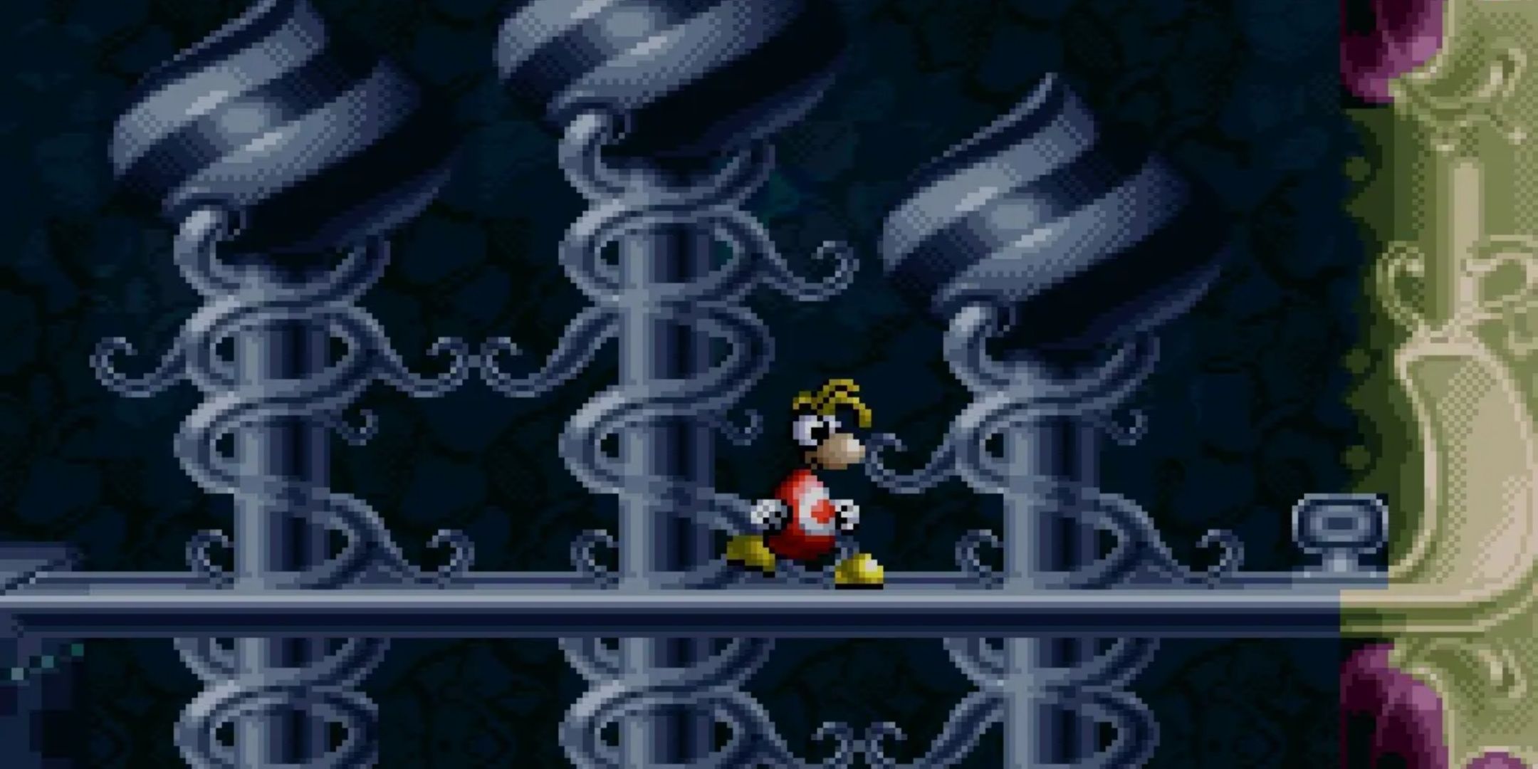 rayman for the snes standing on a walkway.