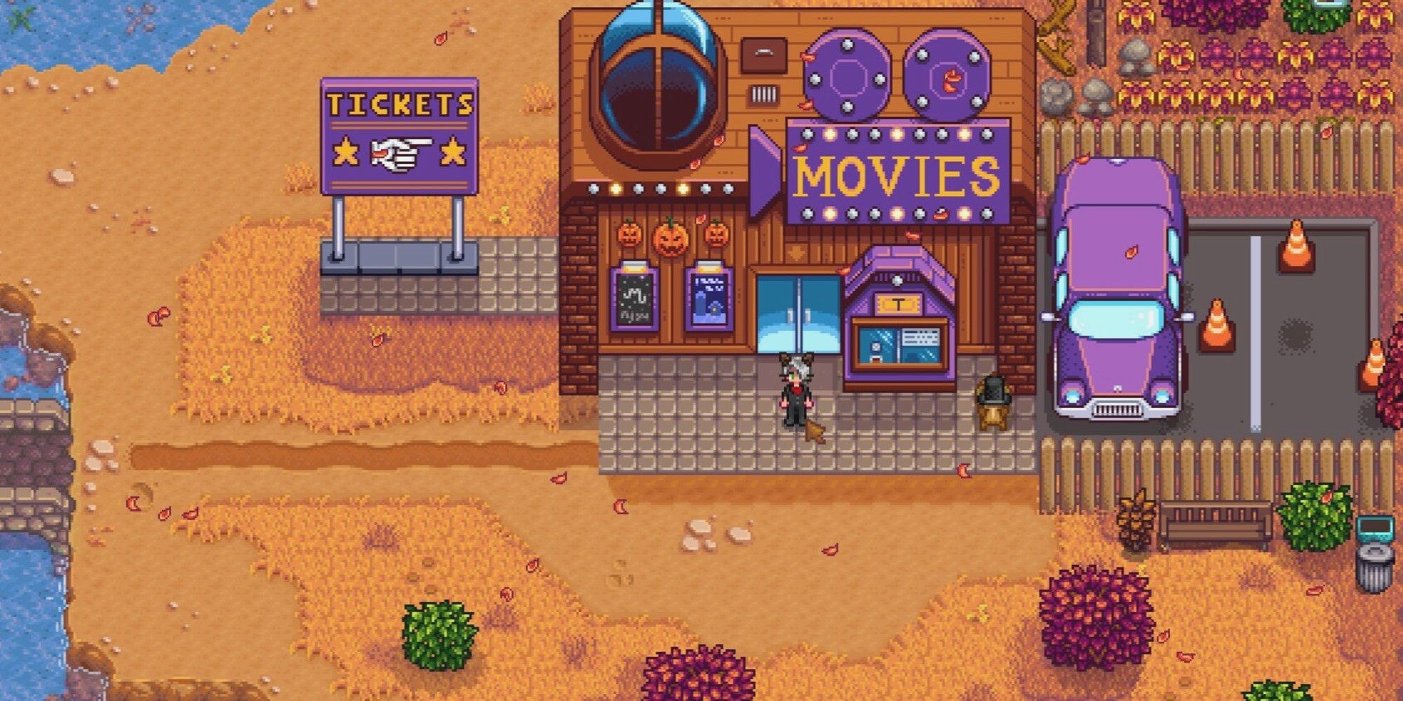 movie theater building in stardew valley with player standing outside.