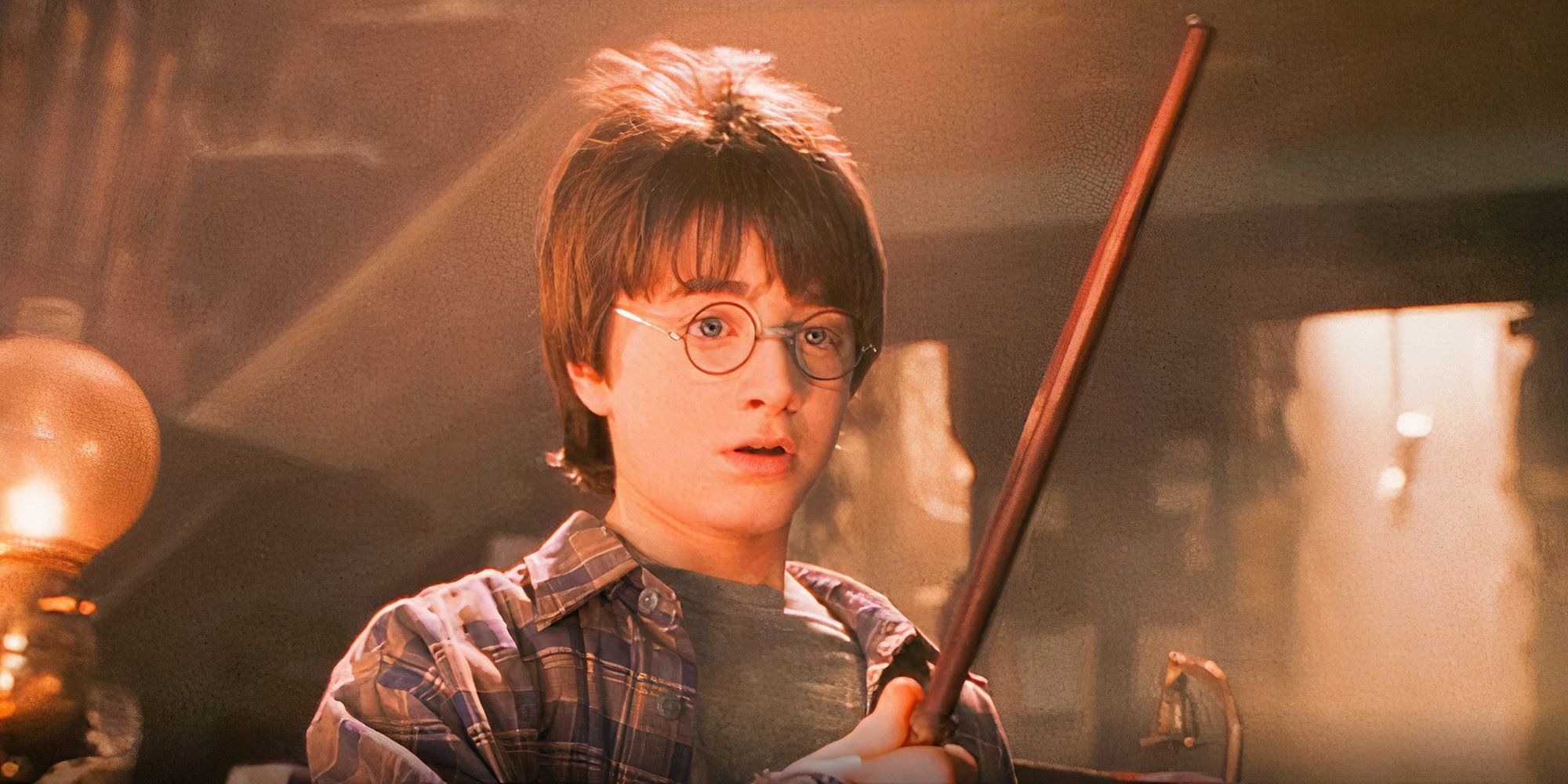 harry potter holding his wand for the first time