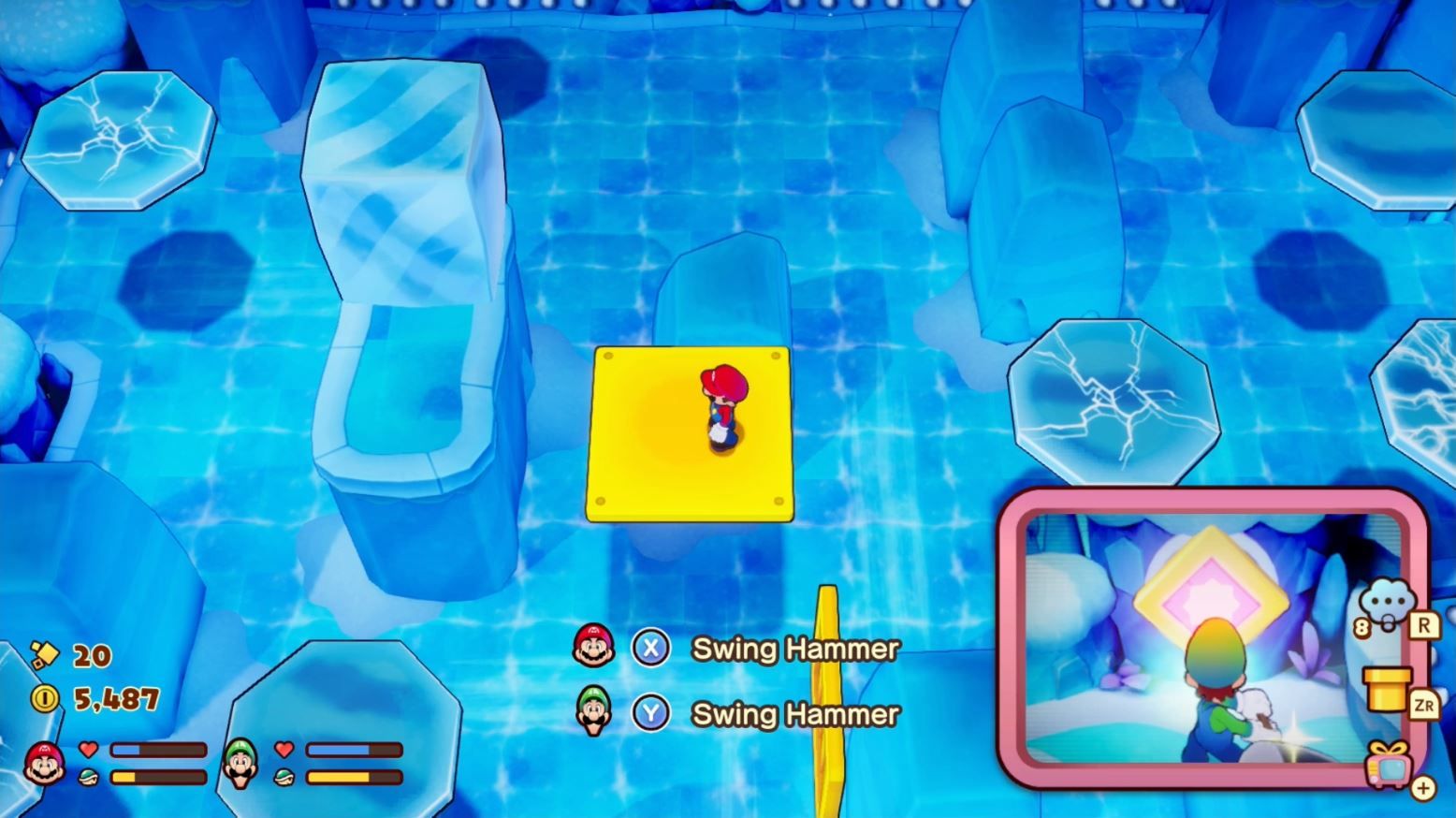 Mario on a yellow platform looking at an iceblock on the left in Mario & Luigi: Brothership.