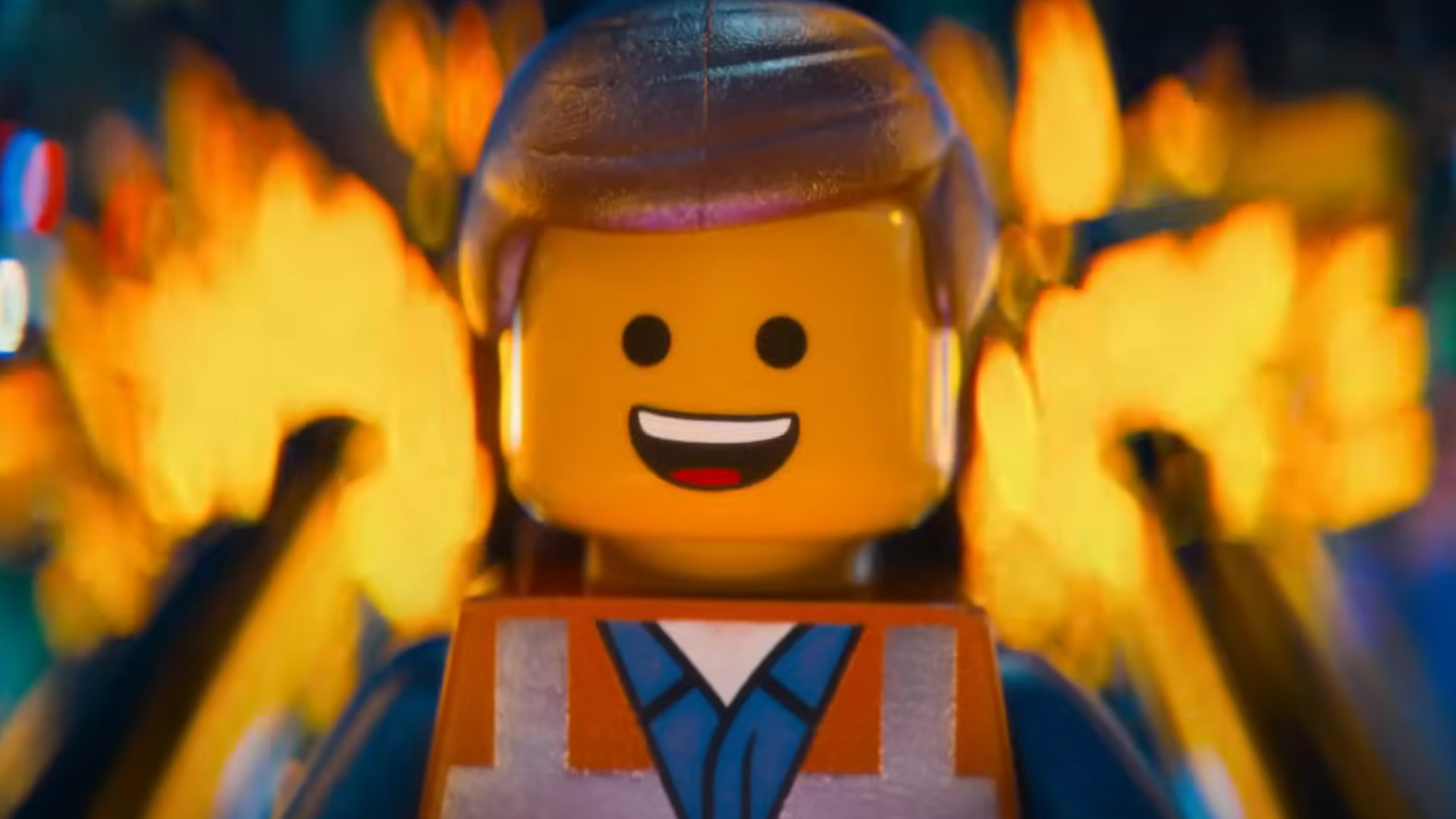 Emmet Brickowski smiling while standing in front of fire during The Lego Movie.