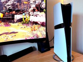 PS5 Pro next to monitor with Ratchet and Clank: Rift Apart gameplay on screen