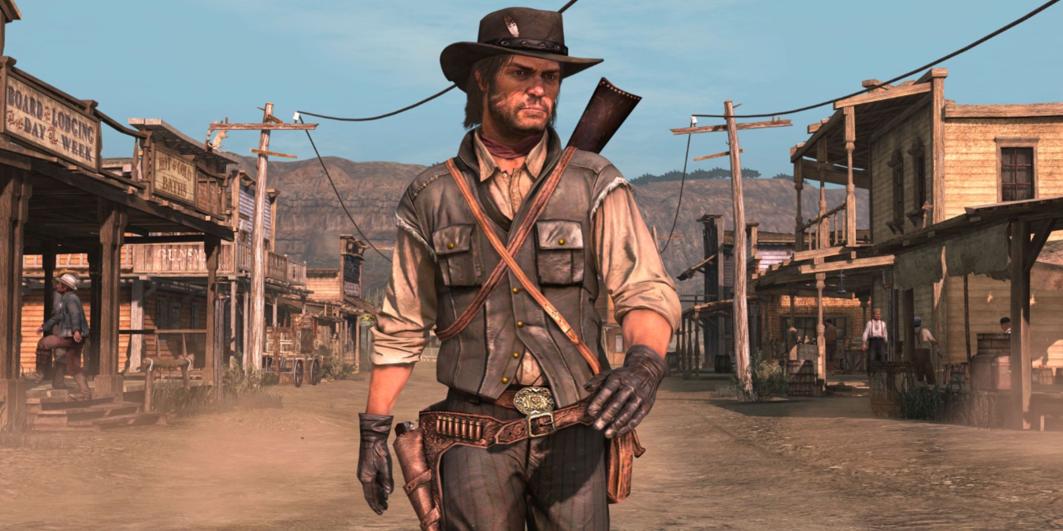 John Marston in full cowboy attire, wlaking through the center of a western town.