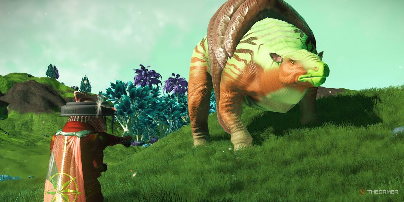 A red No Man's Sky Gek points at a green and orange dinosaur on a paradise planet.