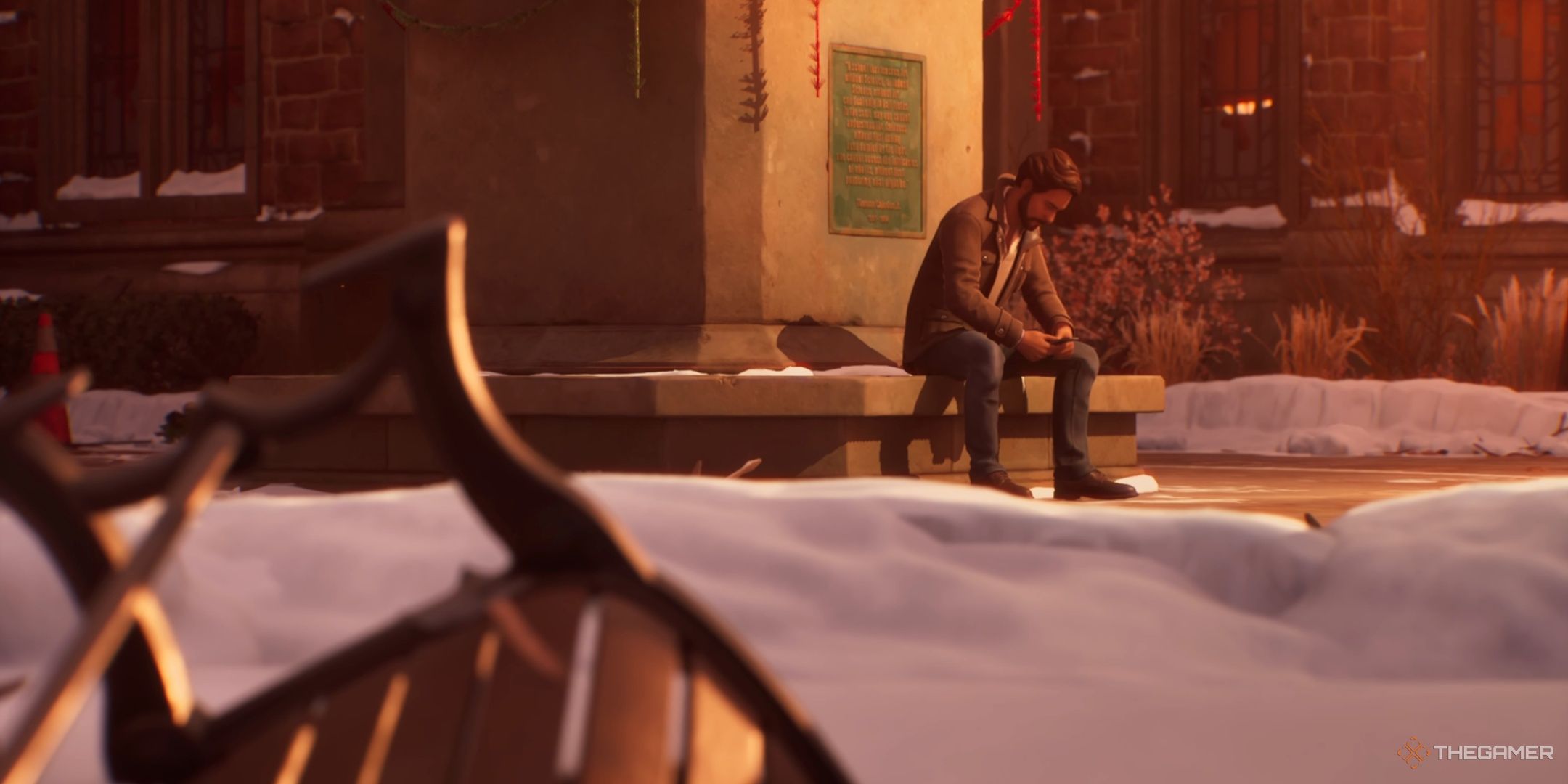 Lucas sits at the base of the Caledon statue in Life is Strange Double Exposure.