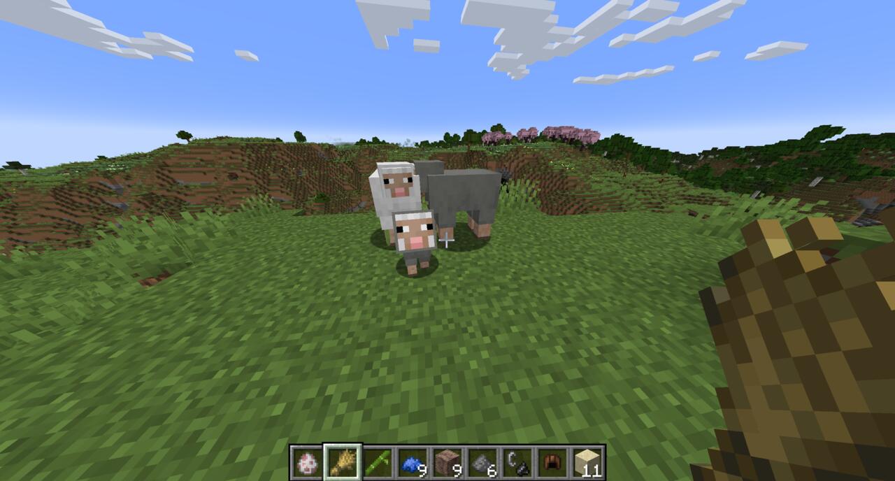 A baby sheep being bred in Minecraft