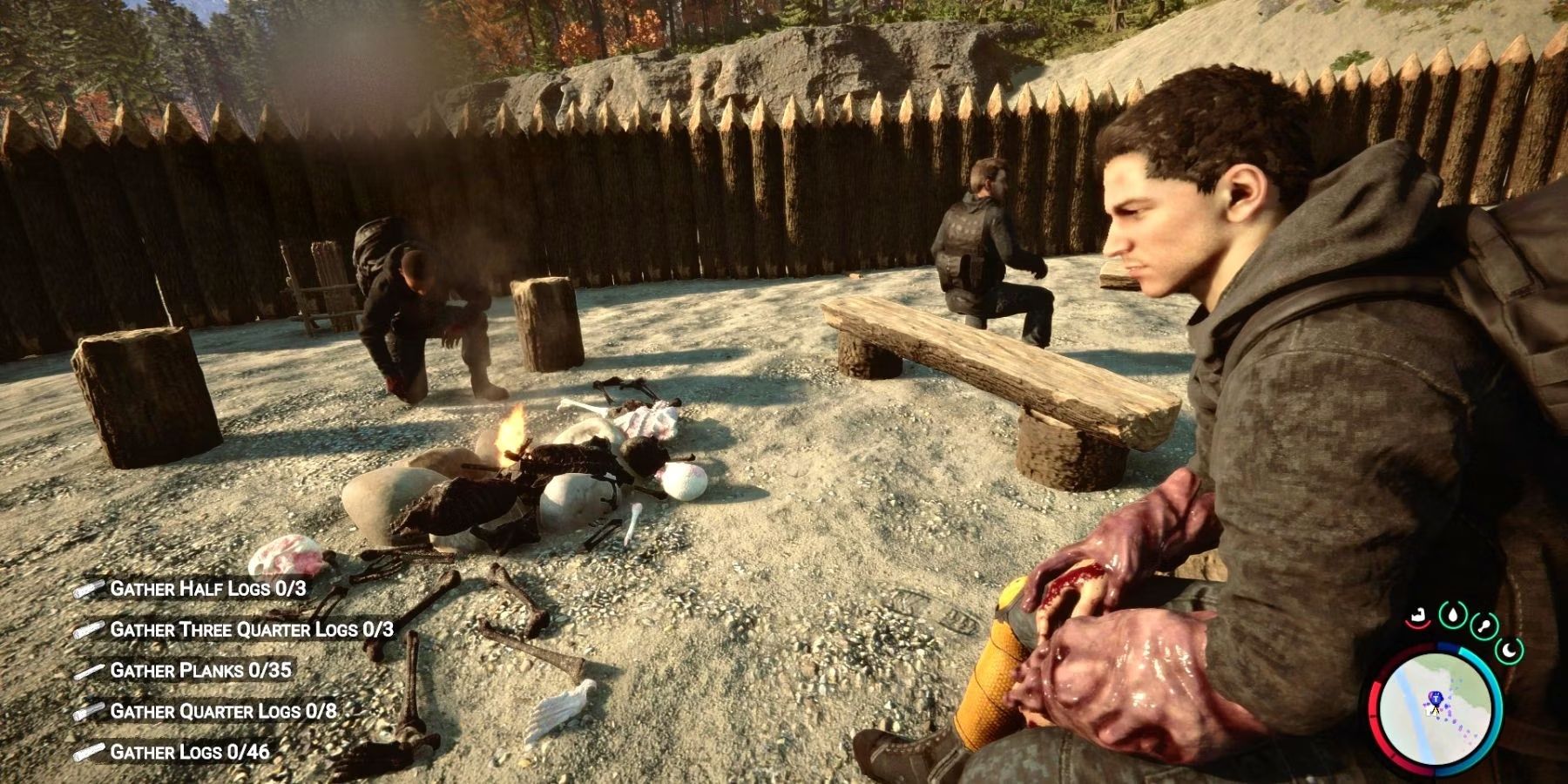 Three players sitting in a sandy area while a scattered skeleton burns in a bonfire in Sons of The Forest.